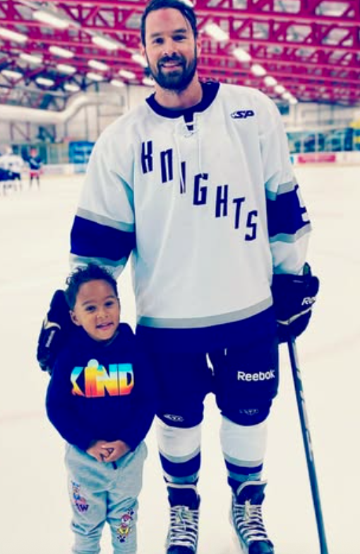 Dr. McLaughlin with family on the ice